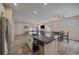 Open concept kitchen with island and stainless steel appliances at 10092 Flower St, Broomfield, CO 80021