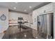 Modern kitchen with stainless steel appliances and breakfast bar at 10092 Flower St, Broomfield, CO 80021