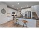 Modern kitchen with white cabinets, granite countertops, and island at 10092 Flower St, Broomfield, CO 80021