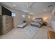 Spacious main bedroom with a dresser, seating area, and large windows at 10092 Flower St, Broomfield, CO 80021
