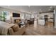 Open concept living area with kitchen, dining, and living spaces at 10092 Flower St, Broomfield, CO 80021