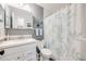 Cozy bathroom with a white vanity, leaf shower curtain, and neutral wall colors at 3058 W 134Th Way, Broomfield, CO 80020