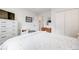 Bedroom featuring a large bed, white dresser, and closet at 3058 W 134Th Way, Broomfield, CO 80020