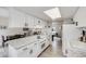 Modern kitchen with white cabinets, stylish countertops, open to living area providing ample space at 3058 W 134Th Way, Broomfield, CO 80020