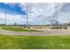 Well-maintained baseball field with dugouts, bleachers, and lights for recreational activities at 305 Titan St, Aurora, CO 80011