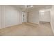 Finished basement area with carpet, storage closet, and access to the basement bathroom at 305 Titan St, Aurora, CO 80011