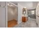 Large bathroom featuring a dual sink vanity, tile floors, and a glass door shower at 305 Titan St, Aurora, CO 80011