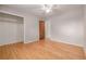 Spacious bedroom featuring hardwood floors and a closet perfect for storage at 305 Titan St, Aurora, CO 80011