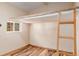 Bedroom with ladder to lofted bed area and a window for natural light at 305 Titan St, Aurora, CO 80011