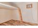 Bedroom with ladder to lofted bed area and air conditioning unit at 305 Titan St, Aurora, CO 80011