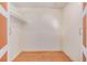 Bedroom closet featuring hardwood floors and a white shelf on the upper part at 305 Titan St, Aurora, CO 80011