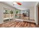 Dining area showcasing an open floor plan with hardwood floors, table, and kitchen access, perfect for entertaining at 305 Titan St, Aurora, CO 80011