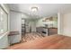 Updated kitchen featuring stainless steel appliances, custom wood cabinets, hardwood floors and a butcher block countertop at 305 Titan St, Aurora, CO 80011