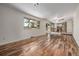 Open living area with hardwood floors, sliding doors, and a view into the updated kitchen for easy entertaining at 305 Titan St, Aurora, CO 80011