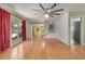 Expansive living room featuring pristine hardwood floors, neutral color palette, and a cozy atmosphere at 305 Titan St, Aurora, CO 80011