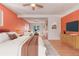Spacious main bedroom with a ceiling fan and an adjoined sitting area at 305 Titan St, Aurora, CO 80011