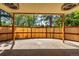Open patio with a tan corrugated metal fence for privacy at 305 Titan St, Aurora, CO 80011