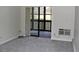 Bedroom space featuring neutral carpeting and sliding glass doors leading to the outside at 14390 E Marina Dr # 104, Aurora, CO 80014