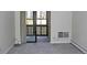 Carpeted bedroom with a glass sliding door with access to an enclosed porch at 14390 E Marina Dr # 104, Aurora, CO 80014