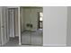 Bedroom showing a mirrored closet and sliding glass doors opening to the enclosed patio at 14390 E Marina Dr # 104, Aurora, CO 80014