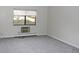 Inviting bedroom featuring neutral carpeting and a window with pleasant outdoor views at 14390 E Marina Dr # 104, Aurora, CO 80014