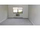 Bright bedroom featuring neutral carpeting and a window with a view of the outdoors at 14390 E Marina Dr # 104, Aurora, CO 80014