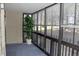 Bright enclosed porch featuring floor-to-ceiling windows and a decorative potted plant at 14390 E Marina Dr # 104, Aurora, CO 80014