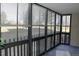 Enclosed porch with large windows that provide a view of the yard at 14390 E Marina Dr # 104, Aurora, CO 80014