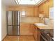 Updated kitchen featuring stainless steel appliances, and light wood cabinetry at 14390 E Marina Dr # 104, Aurora, CO 80014