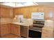 Updated kitchen featuring stainless steel appliances, and light wood cabinetry at 14390 E Marina Dr # 104, Aurora, CO 80014