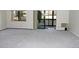 Bright living area with neutral carpet, slider to balcony and large window providing natural light at 14390 E Marina Dr # 104, Aurora, CO 80014