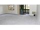 Bright living area with neutral carpet, slider to balcony and large window providing natural light at 14390 E Marina Dr # 104, Aurora, CO 80014