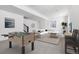 Finished basement with a foosball table, large sofa, and stylish decor at 15378 W 50Th Pl, Golden, CO 80403