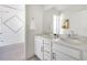 Bathroom features a double sink vanity with marble countertop and shower/tub combo at 15378 W 50Th Pl, Golden, CO 80403
