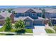 Charming two-story home with a well-maintained lawn and a spacious driveway, showcasing curb appeal at 15378 W 50Th Pl, Golden, CO 80403