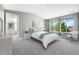 Bright main bedroom features carpet, vaulted ceiling, and large windows with great view at 15378 W 50Th Pl, Golden, CO 80403