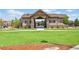 Community recreation area with covered picnic tables and lawn at 15378 W 50Th Pl, Golden, CO 80403