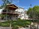 Expansive backyard featuring a wooden deck, patio area, lush lawn and mature trees creating a private outdoor retreat at 2369 Bayberry Ln, Castle Rock, CO 80104