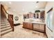 Finished basement features a wet bar, extra storage, and quick access to the stairs at 2369 Bayberry Ln, Castle Rock, CO 80104