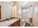 Well-lit bathroom featuring a vanity and a shower and tub combination at 2369 Bayberry Ln, Castle Rock, CO 80104