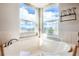 Corner bathtub situated below a picture window with lovely backyard views at 2369 Bayberry Ln, Castle Rock, CO 80104