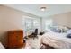 Cozy bedroom with a desk area and plenty of natural light at 2369 Bayberry Ln, Castle Rock, CO 80104