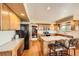 Functional kitchen with an island and breakfast bar, ample cabinet space, and hardwood flooring at 2369 Bayberry Ln, Castle Rock, CO 80104