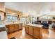 Spacious kitchen with stainless steel appliances and an island, seamlessly connected to the living room at 2369 Bayberry Ln, Castle Rock, CO 80104