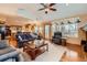 Open-concept living room showcasing hardwood floors, ample seating, and a connected kitchen at 2369 Bayberry Ln, Castle Rock, CO 80104