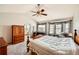 Spacious main bedroom featuring an ensuite entrance, a seating area, and a vaulted ceiling at 2369 Bayberry Ln, Castle Rock, CO 80104