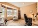 Bright home office space with large windows providing natural light and ample workspace at 2369 Bayberry Ln, Castle Rock, CO 80104