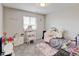 Bedroom featuring cute decor, a desk, and a twin bed at 8071 Tabor St, Arvada, CO 80005