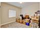 Bedroom showing storage boxes and blinds on a window, showing plenty of space at 8071 Tabor St, Arvada, CO 80005