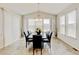 Vaulted ceiling dining room filled with natural light, features seating for six at 8071 Tabor St, Arvada, CO 80005